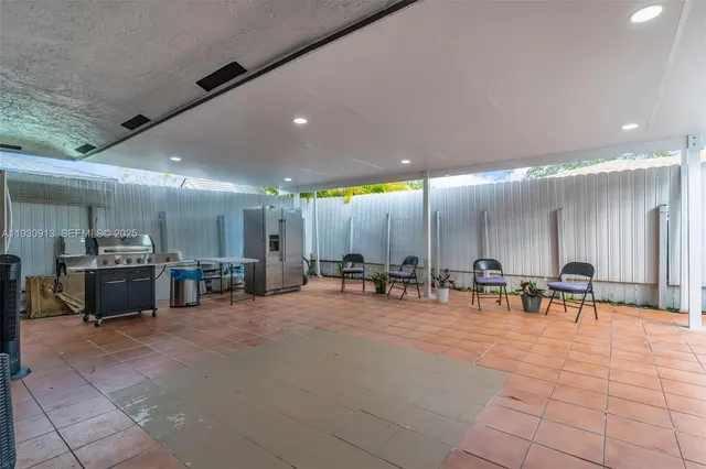 a group of chairs and tables in a room