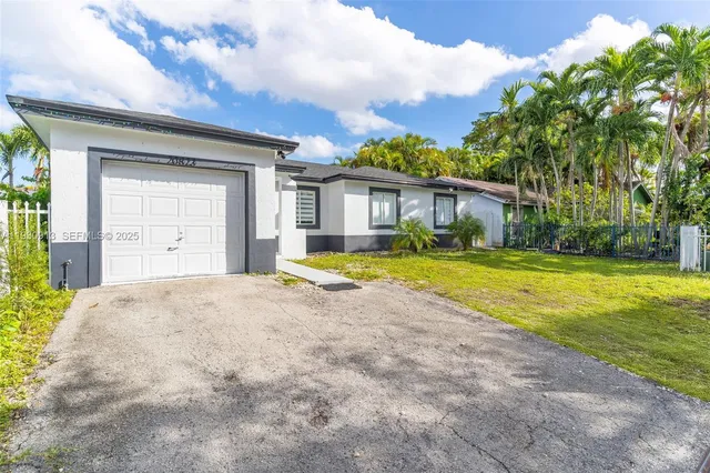 a view of a house with swimming pool and porch with furniture