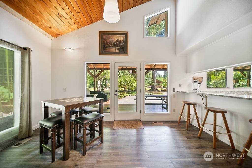 1171 Big Pine Way Forks, WA 98331 - Photo 13 of 40 a view of a dining room with furniture window and wooden floor