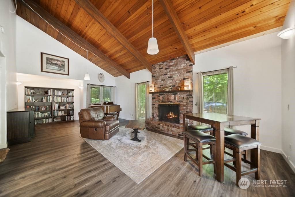 1171 Big Pine Way Forks, WA 98331 - Photo 14 of 40 a living room with furniture a fireplace and a table