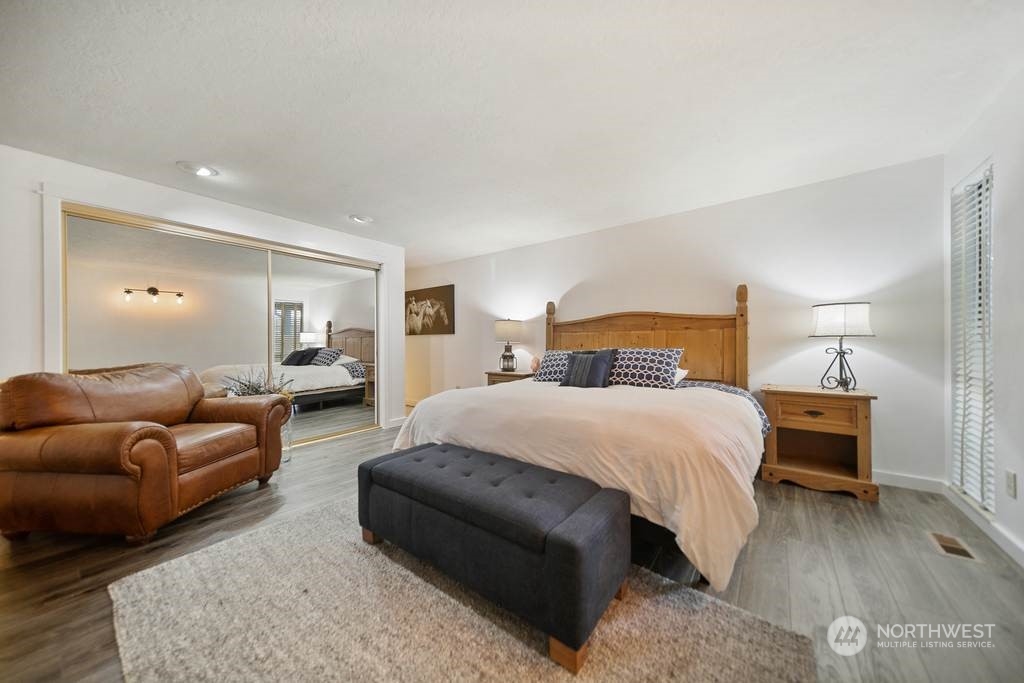 1171 Big Pine Way Forks, WA 98331 - Photo 15 of 40 a bedroom with a bed couch and a night stand