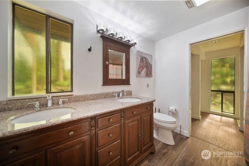 1171 Big Pine Way Forks, WA 98331 - Photo 16 of 40 a bathroom with a granite countertop sink toilet and mirror