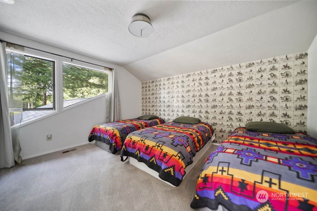 1171 Big Pine Way Forks, WA 98331 - Photo 23 of 40 a bedroom with a bed and a window