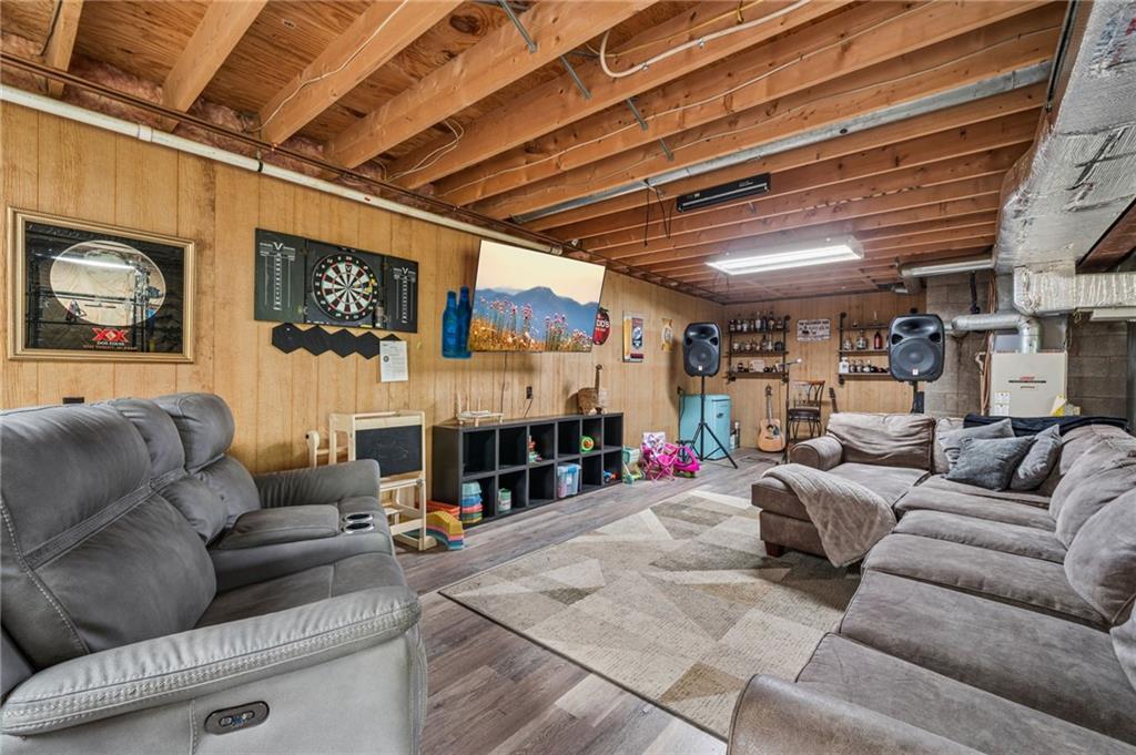 905 Indian Creek Valley Road Normalville, PA 15469 - Photo 28 of 38 a living room with furniture and a fireplace