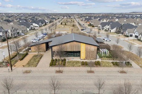 an aerial view of a house with a garden