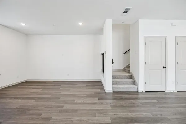 a view of an entryway with wooden floor