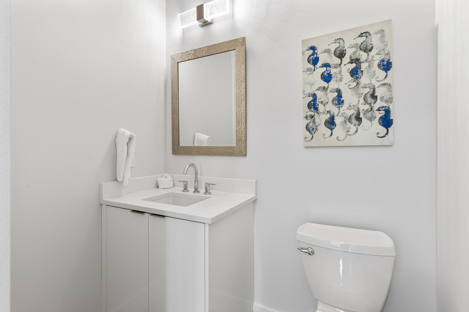 39 Charlotte Avenue Miramar Beach, FL 32550 - Photo 34 of 58 a bathroom with a toilet sink and mirror