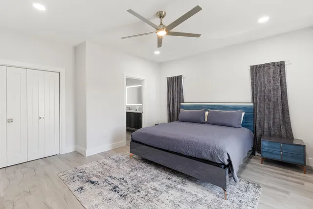 a living room with furniture and painting on the wall