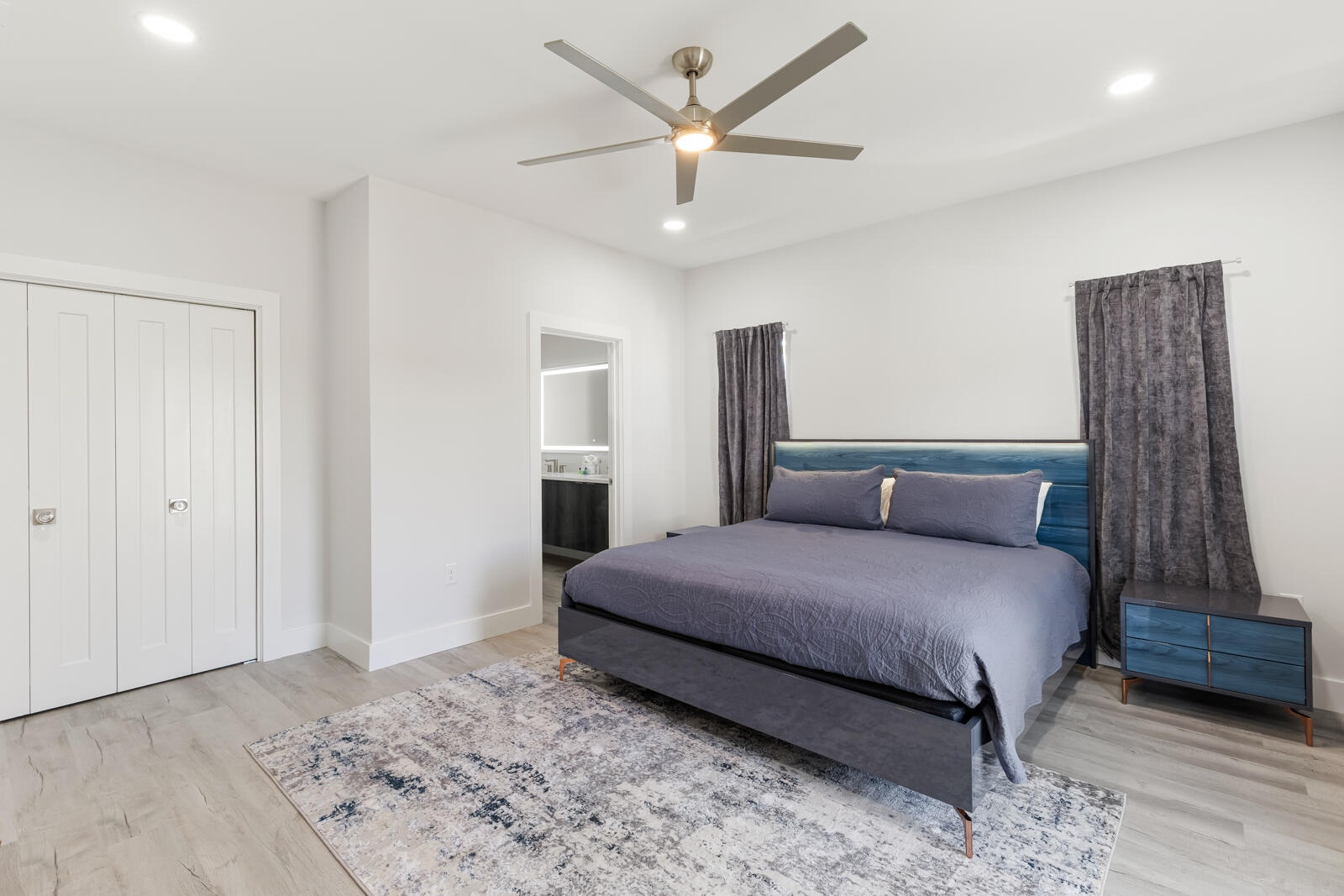 39 Charlotte Avenue Miramar Beach, FL 32550 - Photo 46 of 58 a bedroom with a large bed and a chandelier