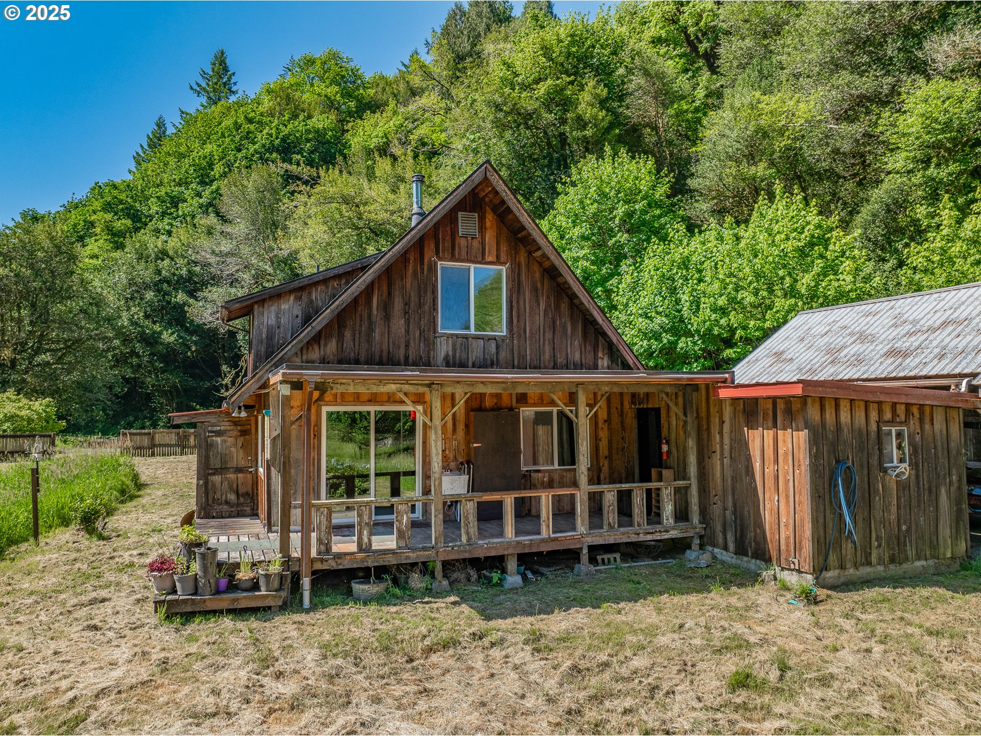 56101 Brummit Creek Road Myrtle Point, OR 97458 - Photo 13 of 47 a view of a small house in the back yard