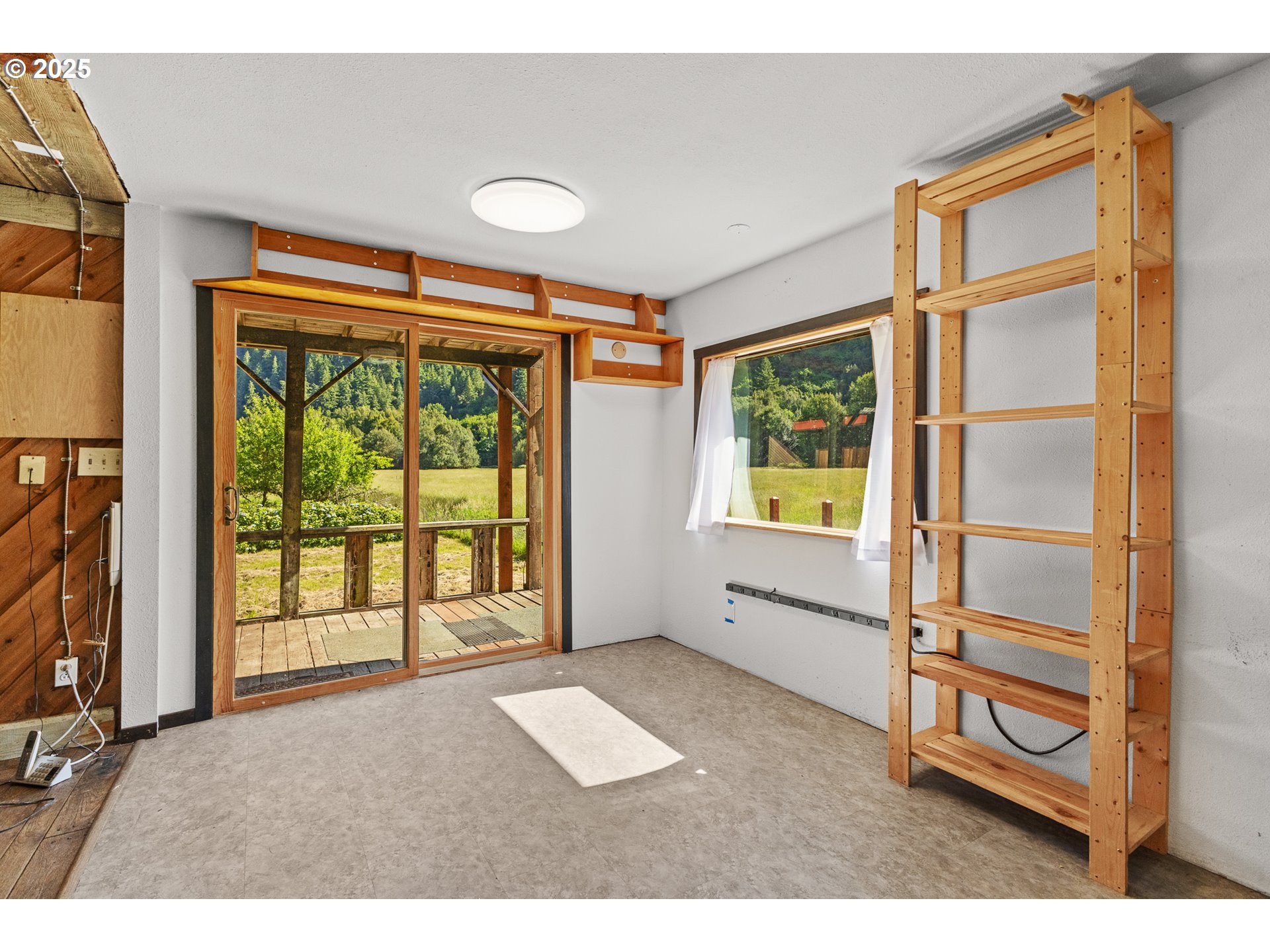 56101 Brummit Creek Road Myrtle Point, OR 97458 - Photo 20 of 47 a view of an empty room with a window