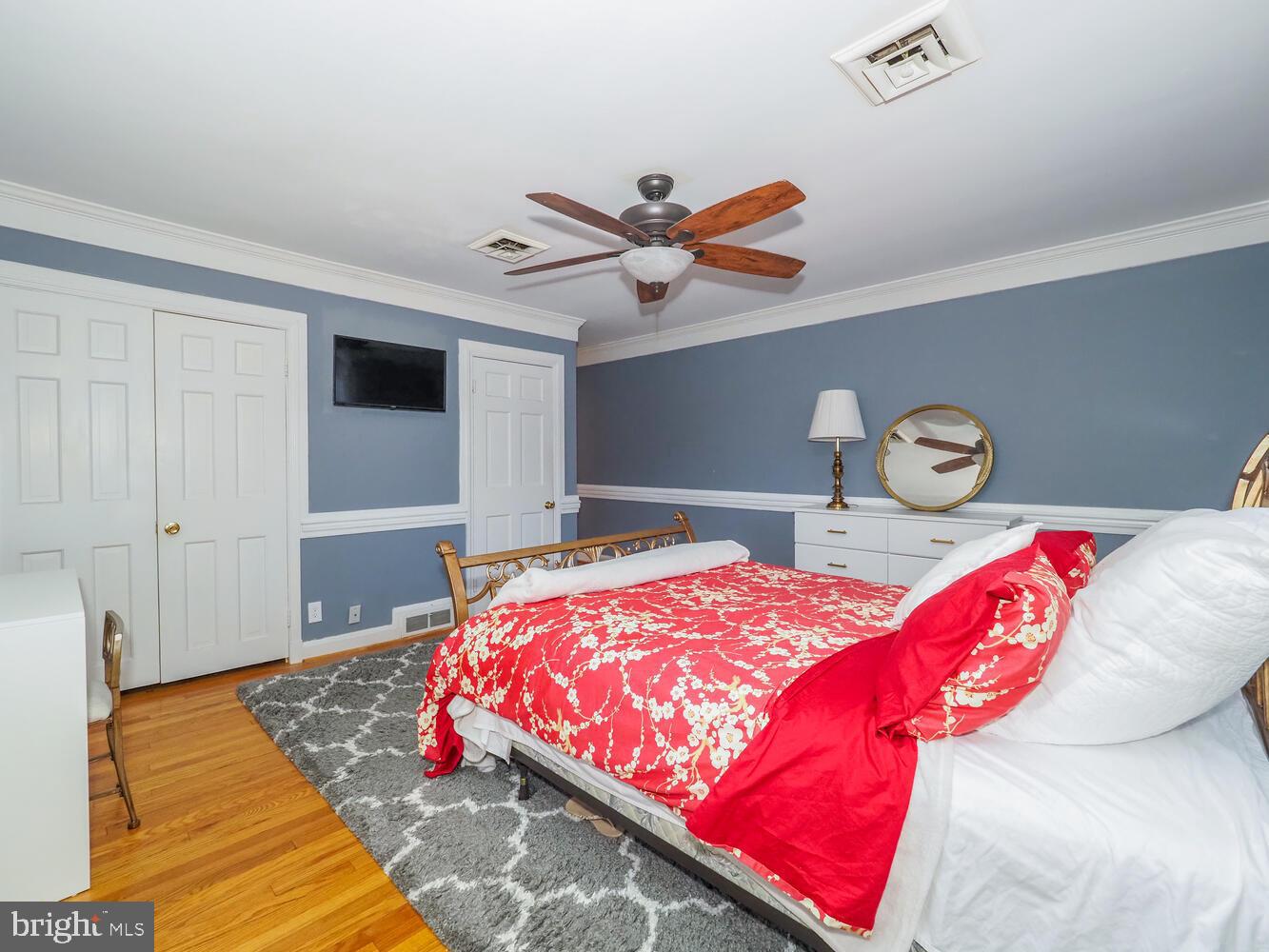 1108 Hampton Garth Towson, MD 21286 - Photo 13 of 53 a bedroom with bed and wooden floor