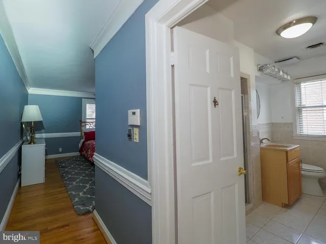 a bathroom with a bathtub and a toilet