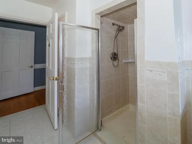 a bathroom with a glass shower door