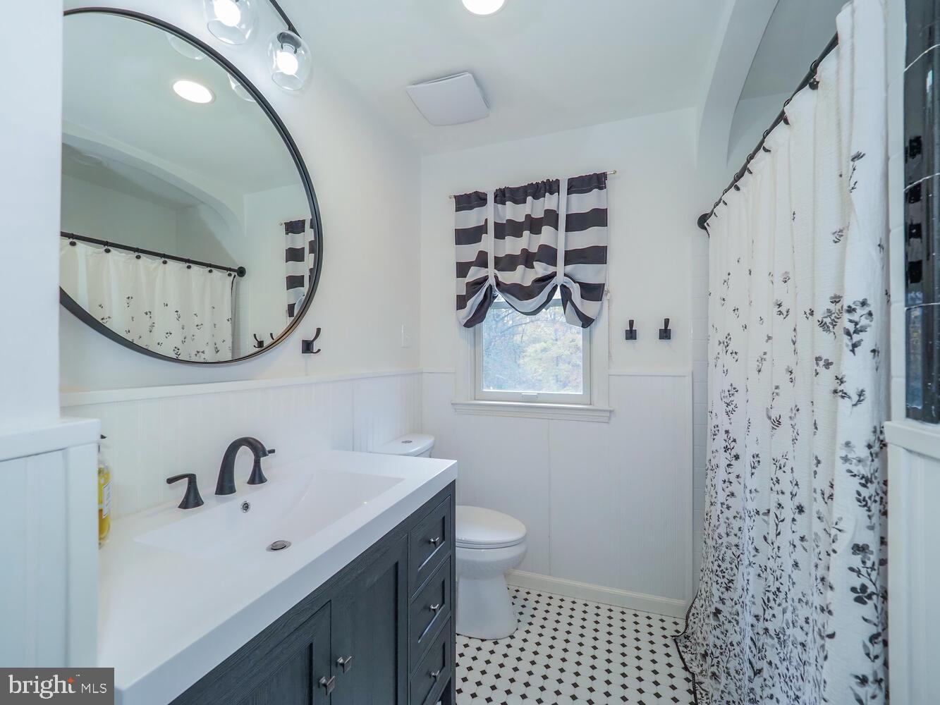1108 Hampton Garth Towson, MD 21286 - Photo 20 of 53 a bathroom with a sink and a mirror