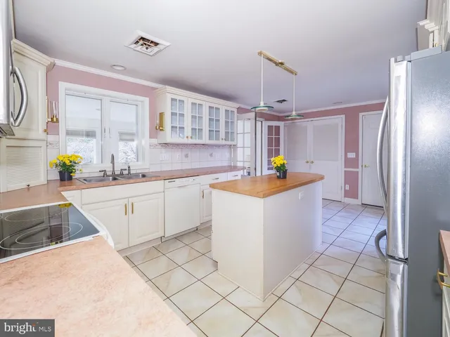 a kitchen with a sink stove and refrigerator