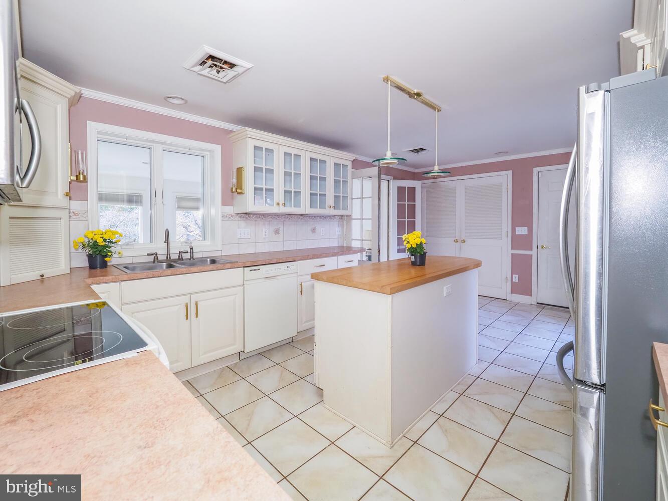 1108 Hampton Garth Towson, MD 21286 - Photo 25 of 53 a kitchen with a sink stove and refrigerator