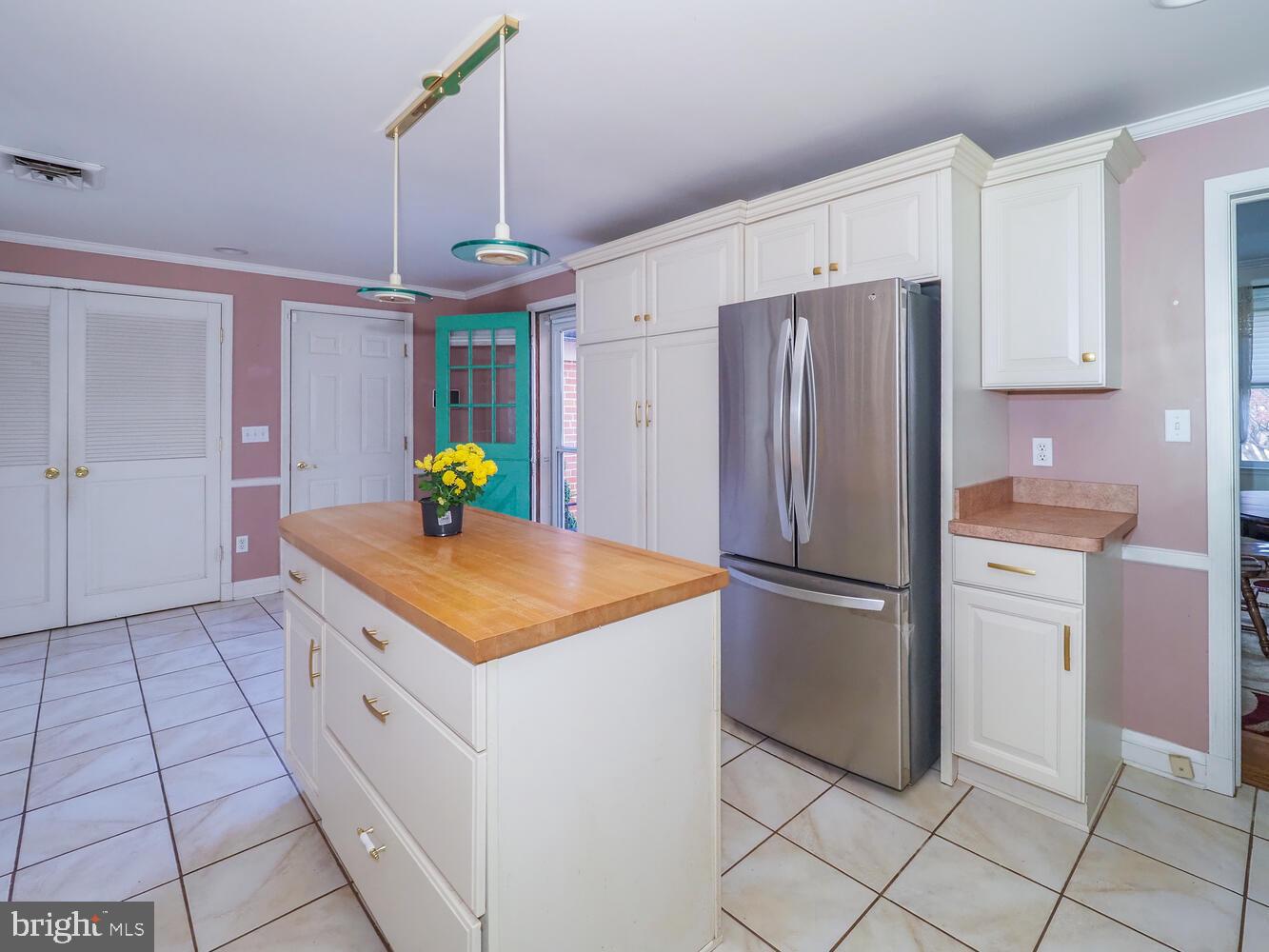 1108 Hampton Garth Towson, MD 21286 - Photo 28 of 53 a kitchen with a refrigerator a stove top oven and a refrigerator