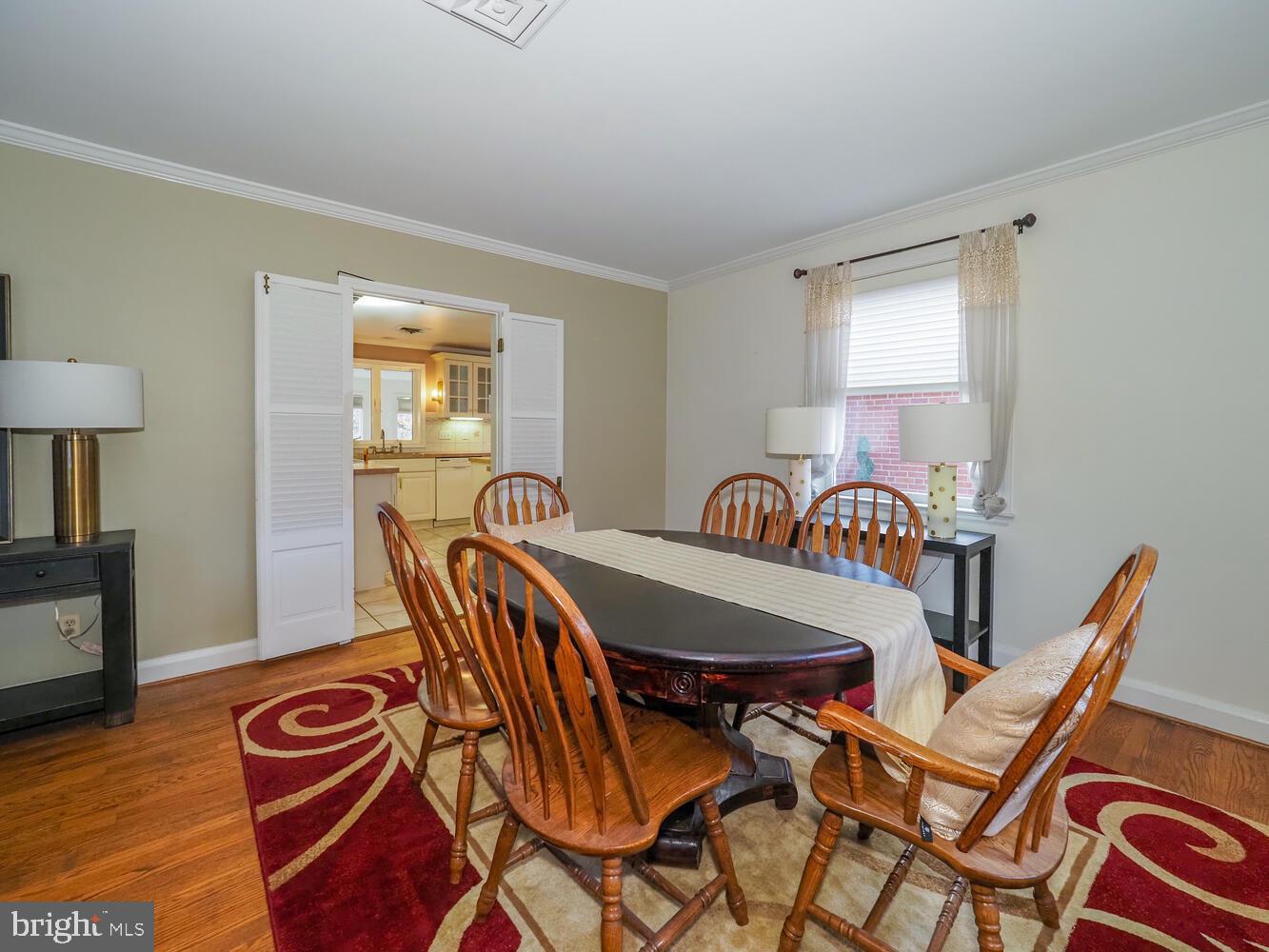 1108 Hampton Garth Towson, MD 21286 - Photo 30 of 53 a view of a dining room with furniture and wooden floor