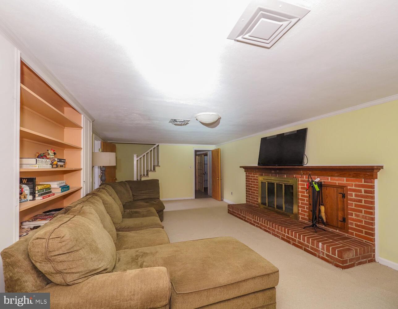 1108 Hampton Garth Towson, MD 21286 - Photo 46 of 53 a living room with furniture and a flat screen tv