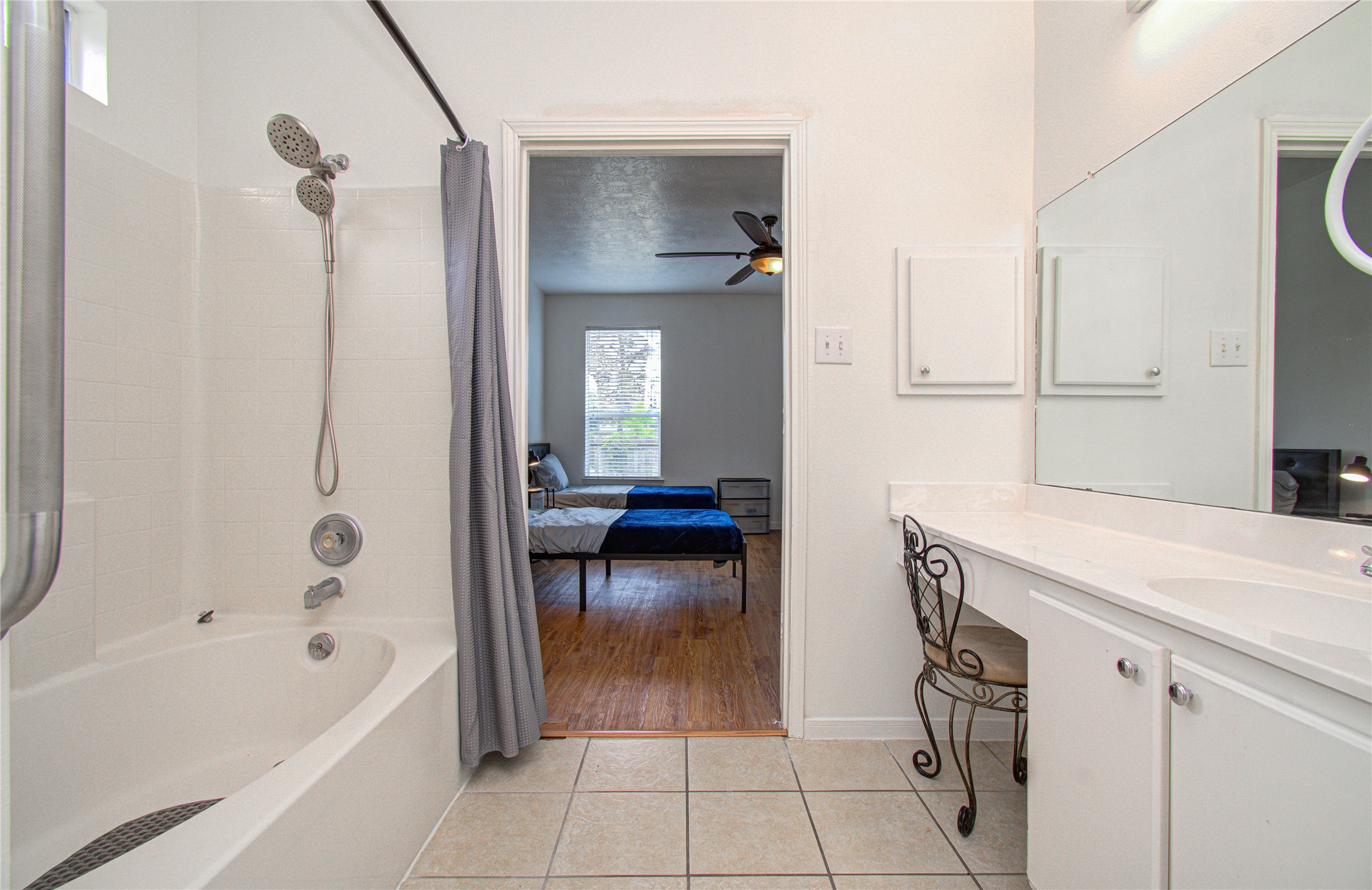 24135 Pinecreek Point Spring, TX 77373 - Photo 20 of 30 a en suite bathroom with a tub shower and a sink