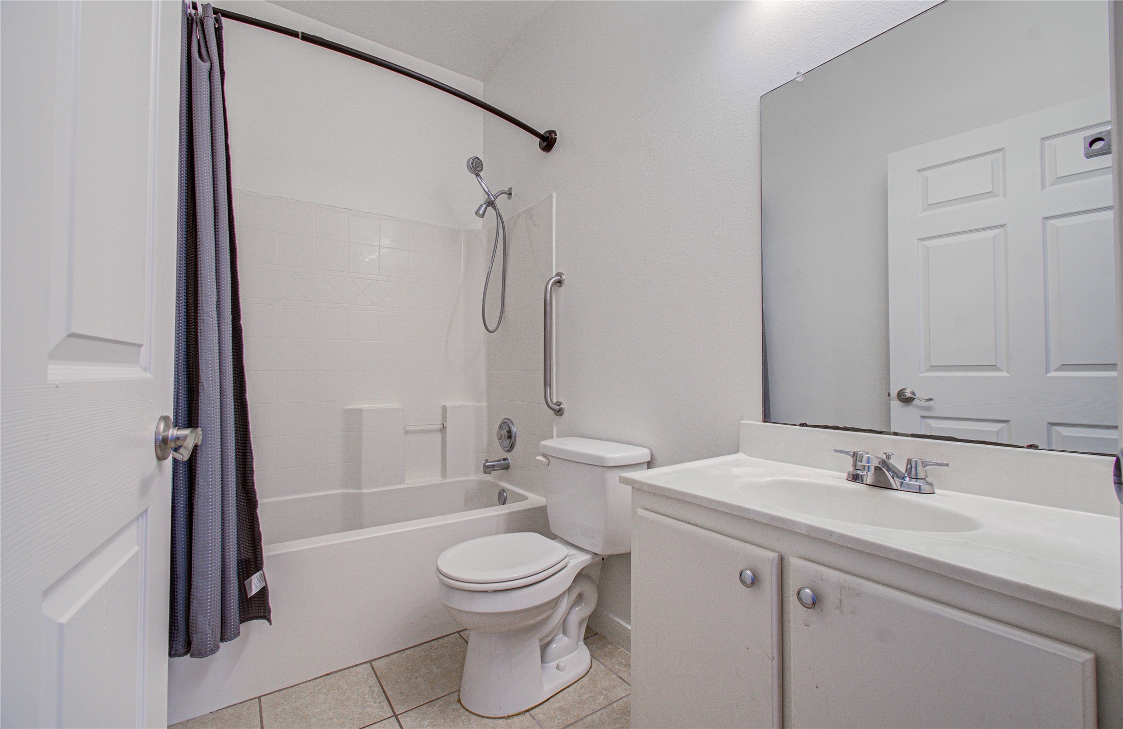 24135 Pinecreek Point Spring, TX 77373 - Photo 21 of 30 a bathroom with a double vanity sink toilet and shower