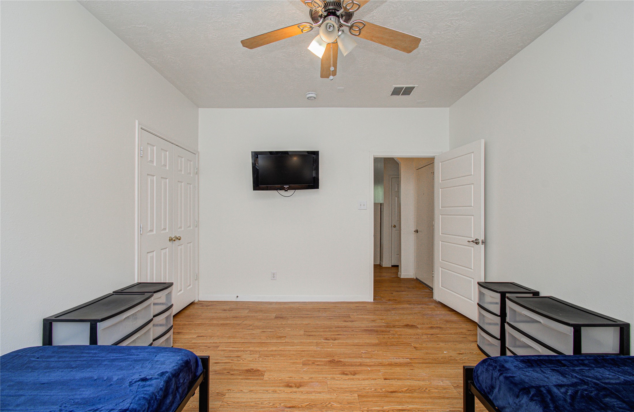 24135 Pinecreek Point Spring, TX 77373 - Photo 23 of 30 a bedroom with a bed and a flat screen tv