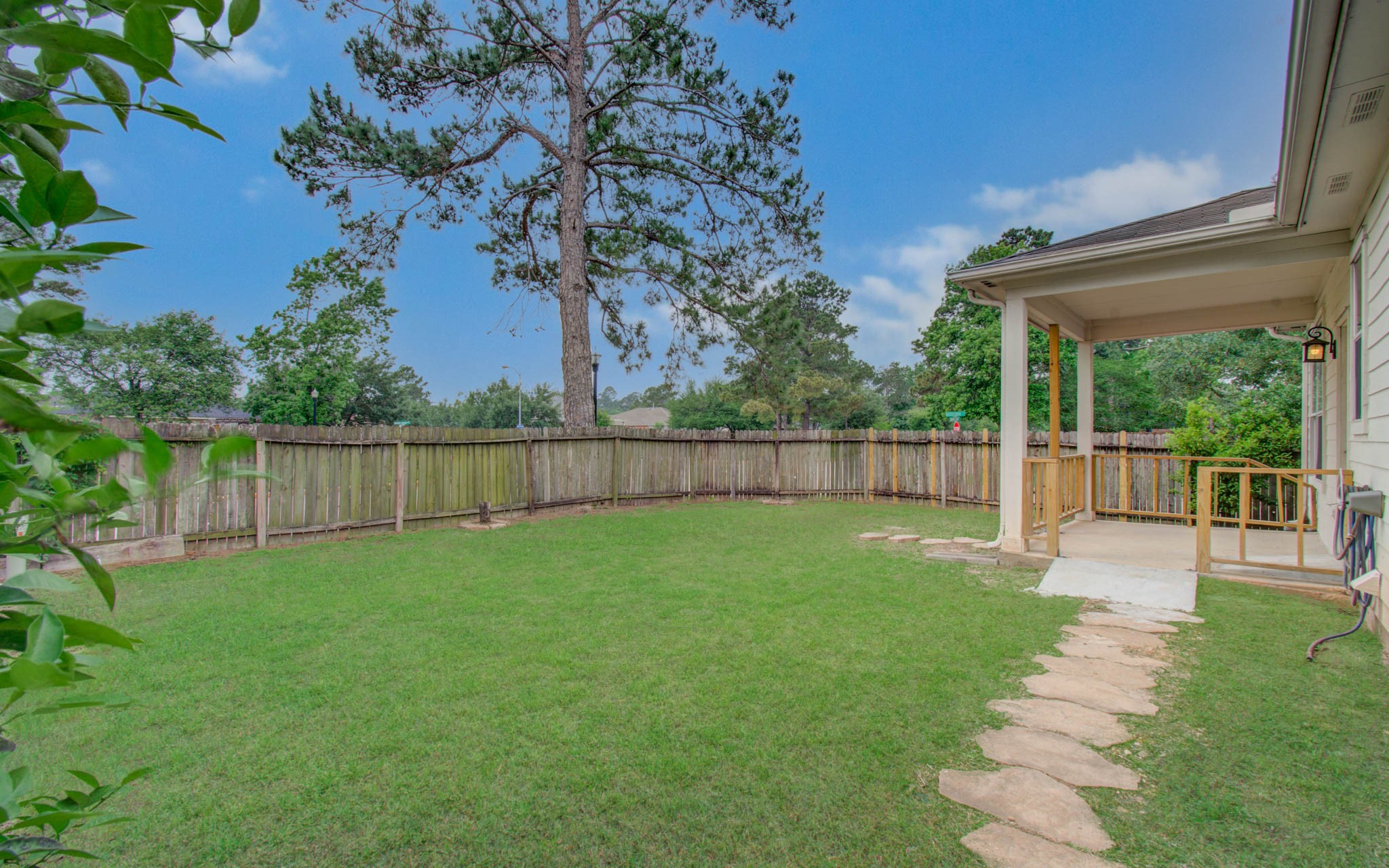 24135 Pinecreek Point Spring, TX 77373 - Photo 26 of 30 a view of a backyard with a garden