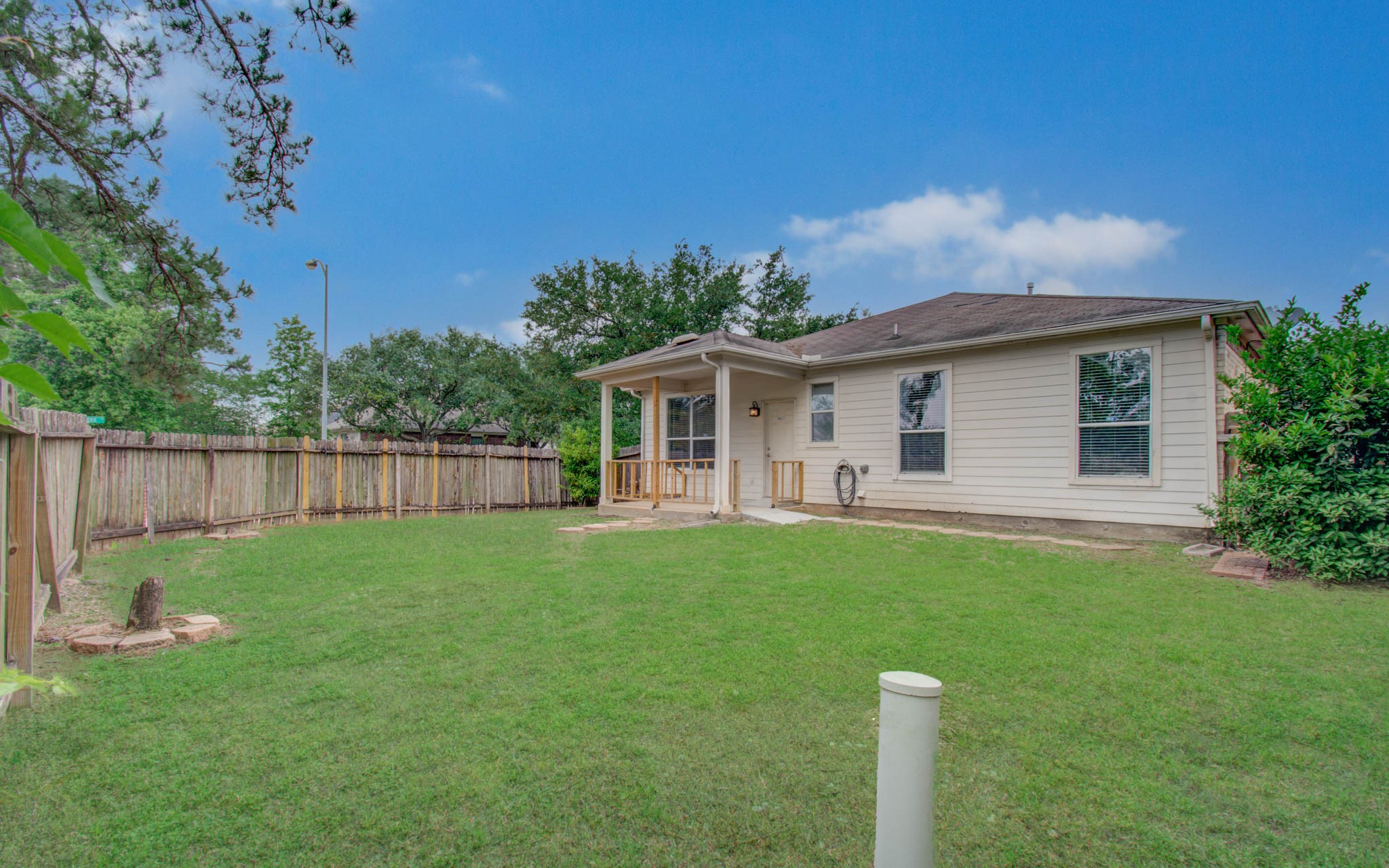24135 Pinecreek Point Spring, TX 77373 - Photo 27 of 30 a view of a house with backyard and porch