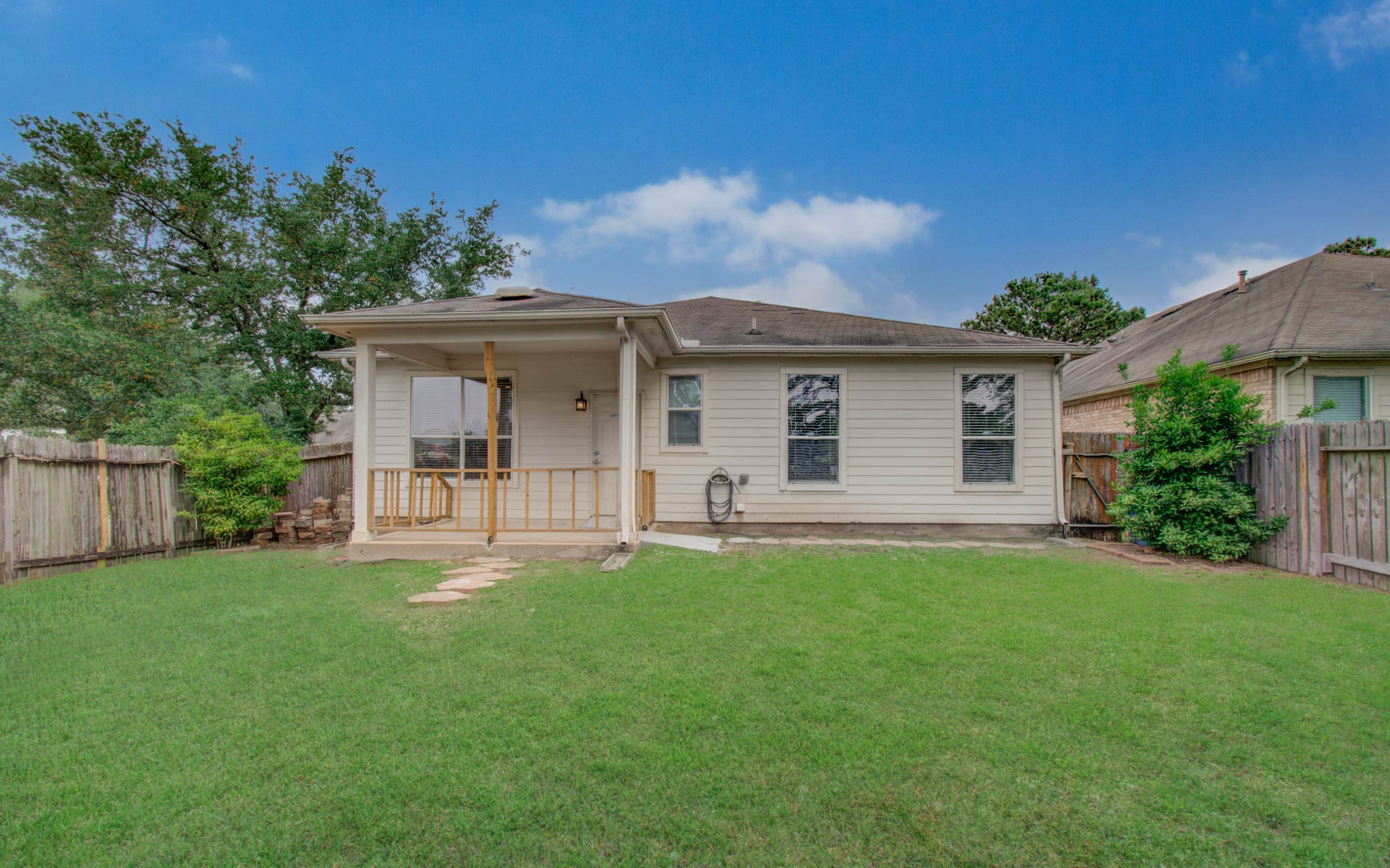 24135 Pinecreek Point Spring, TX 77373 - Photo 28 of 30 a front view of a house with a yard and garage