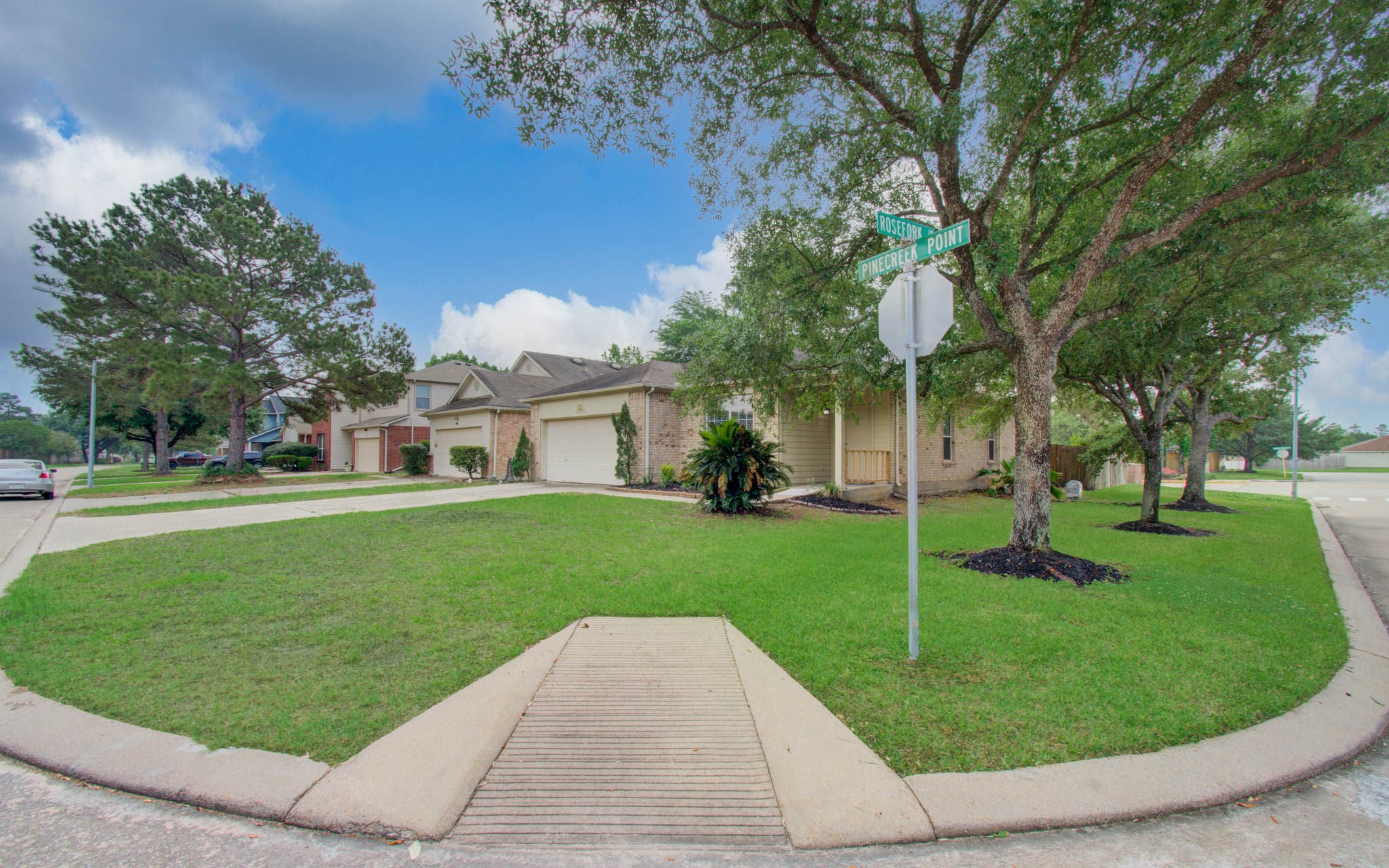 24135 Pinecreek Point Spring, TX 77373 - Photo 3 of 30 a aerial view of a house with a yard