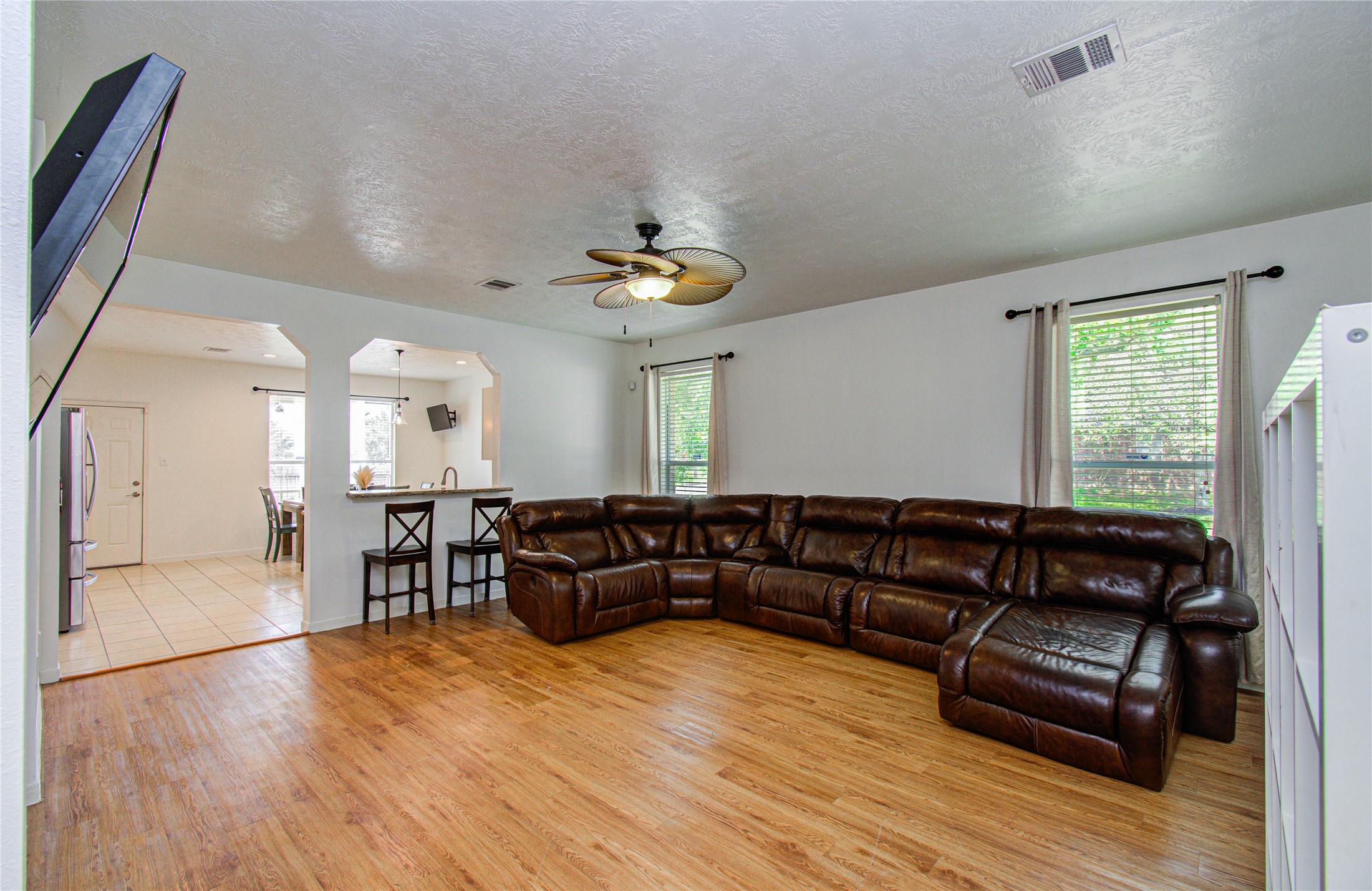 24135 Pinecreek Point Spring, TX 77373 - Photo 7 of 30 a living room with furniture and wooden floor