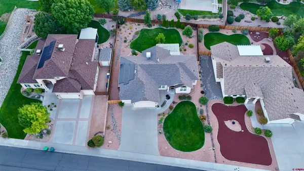 an aerial view of a house with outdoor space