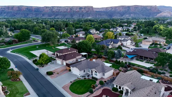 an aerial view of a house and outdoor space