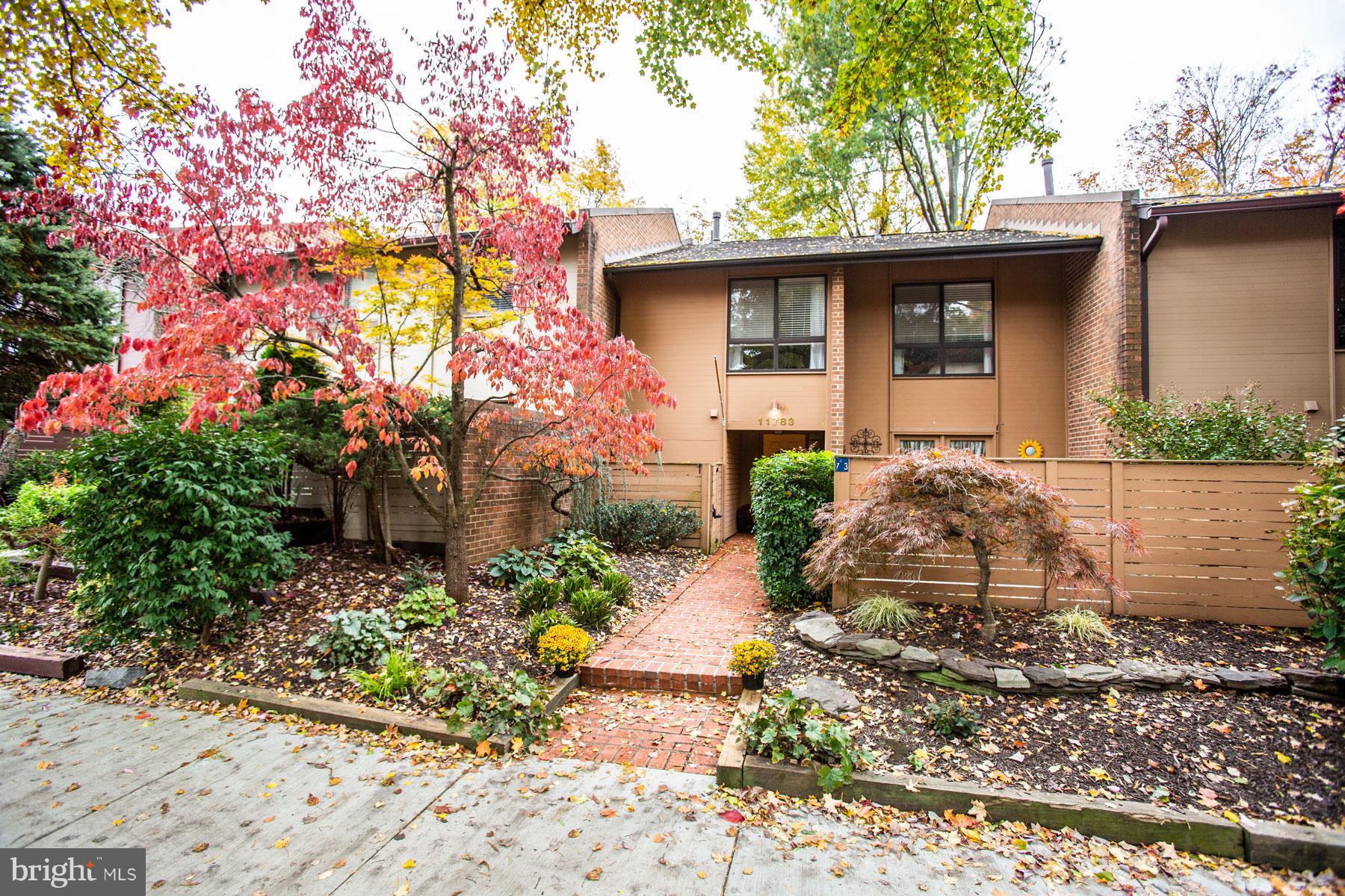 11783 Indian Ridge Road Reston, VA 20191 - Photo 2 of 25 a front view of a house with a garden