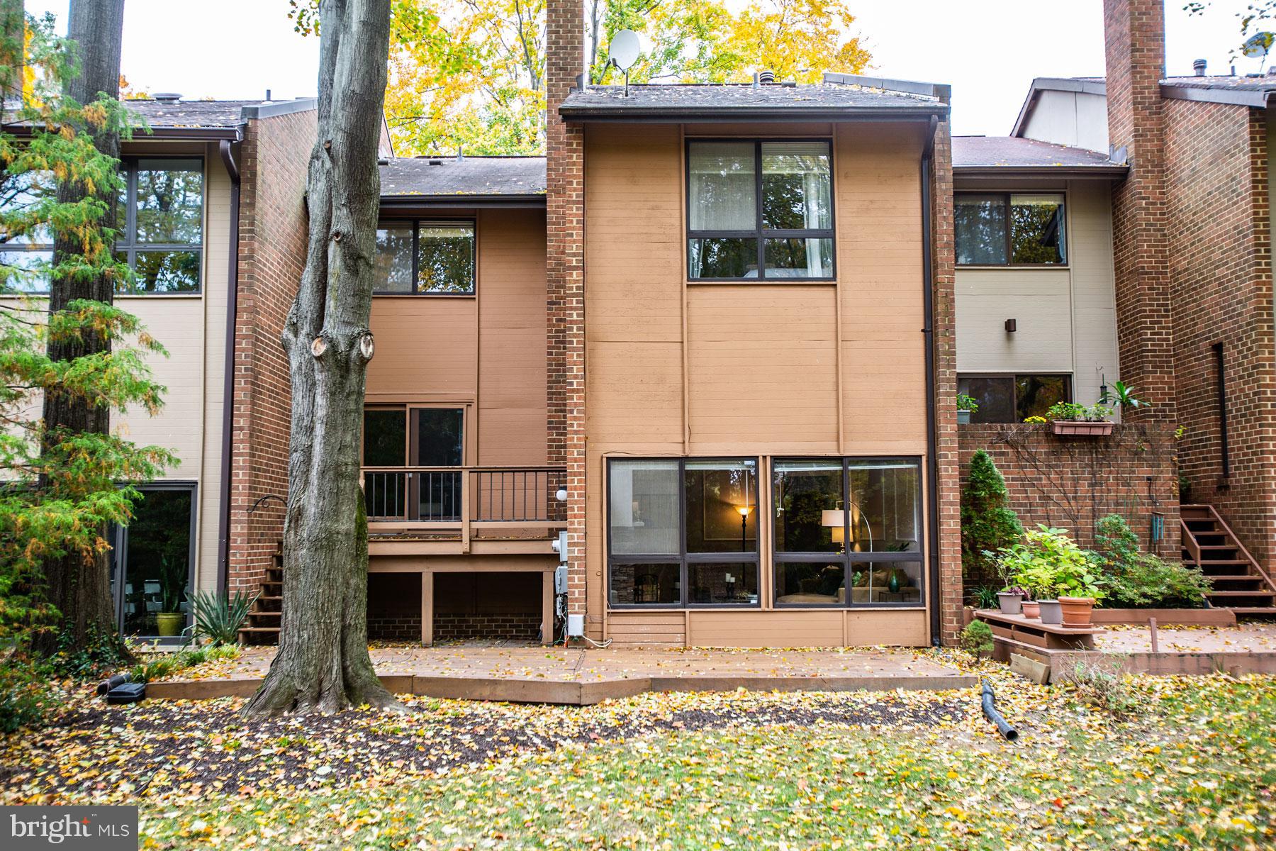 11783 Indian Ridge Road Reston, VA 20191 - Photo 21 of 25 a front view of a house with a garden