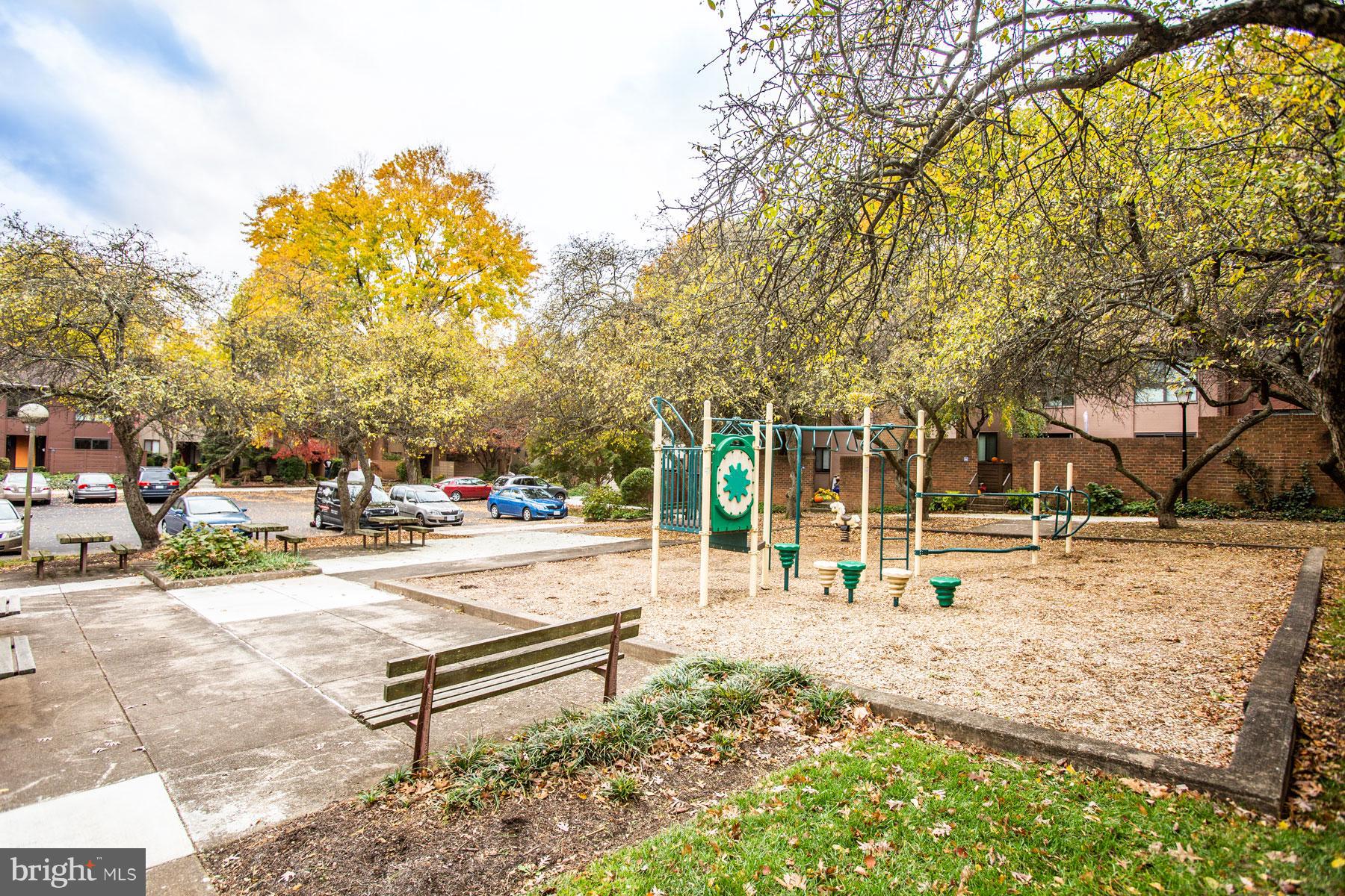 11783 Indian Ridge Road Reston, VA 20191 - Photo 23 of 25 a swimming pool with outdoor seating and trees