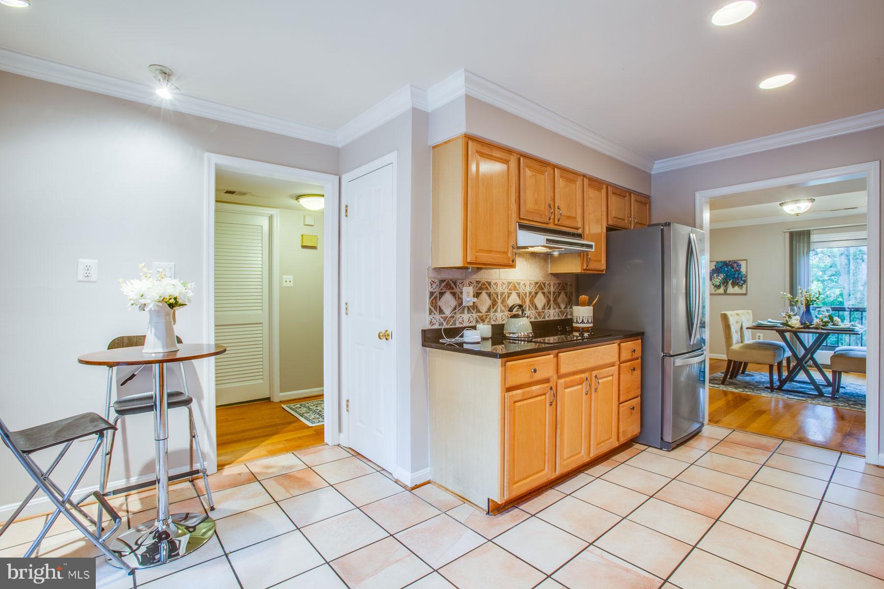 11783 Indian Ridge Road Reston, VA 20191 - Photo 5 of 25 a kitchen with stainless steel appliances granite countertop a refrigerator and a stove