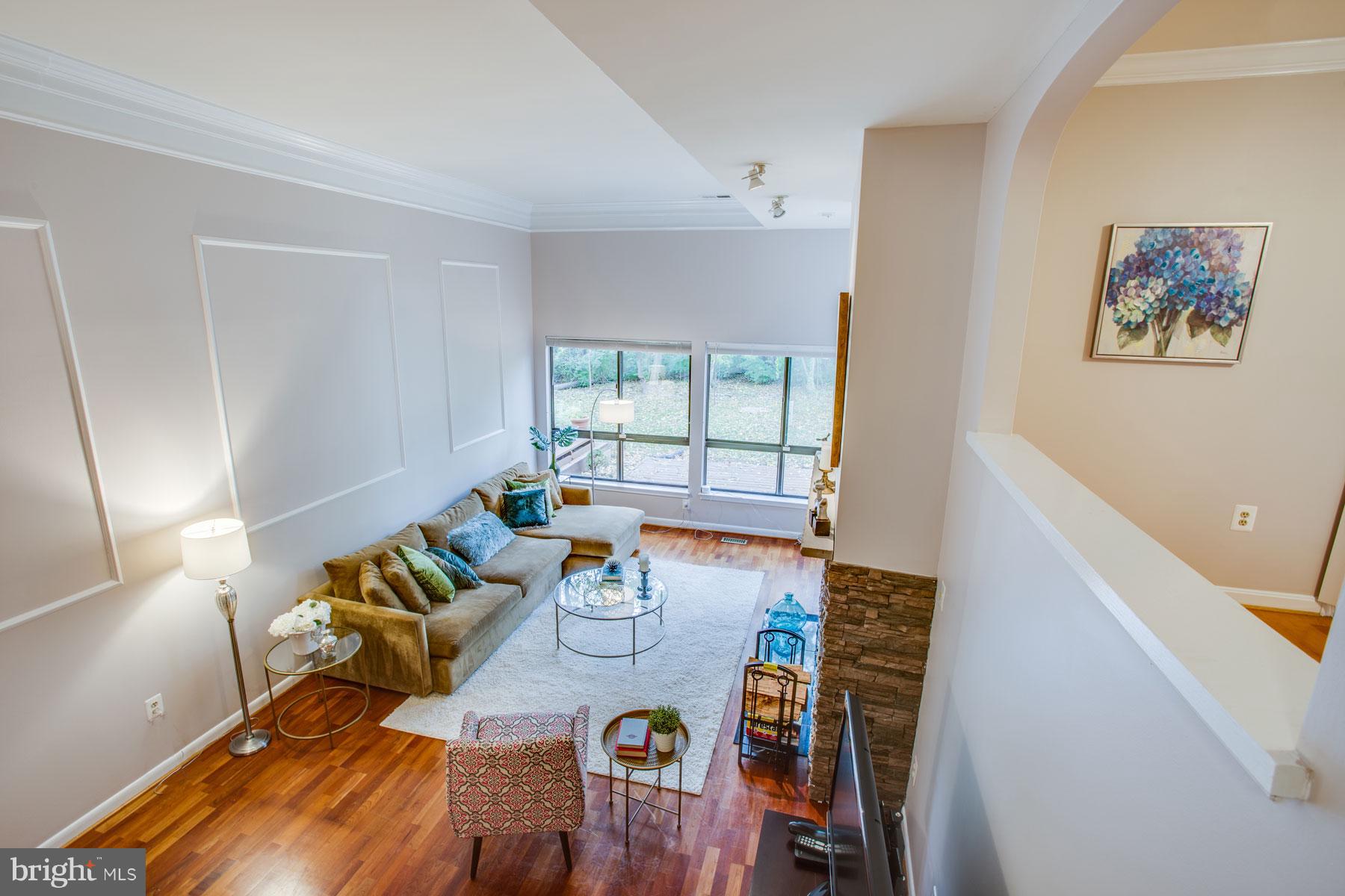 11783 Indian Ridge Road Reston, VA 20191 - Photo 8 of 25 a view of a dining room with furniture a rug and wooden floor