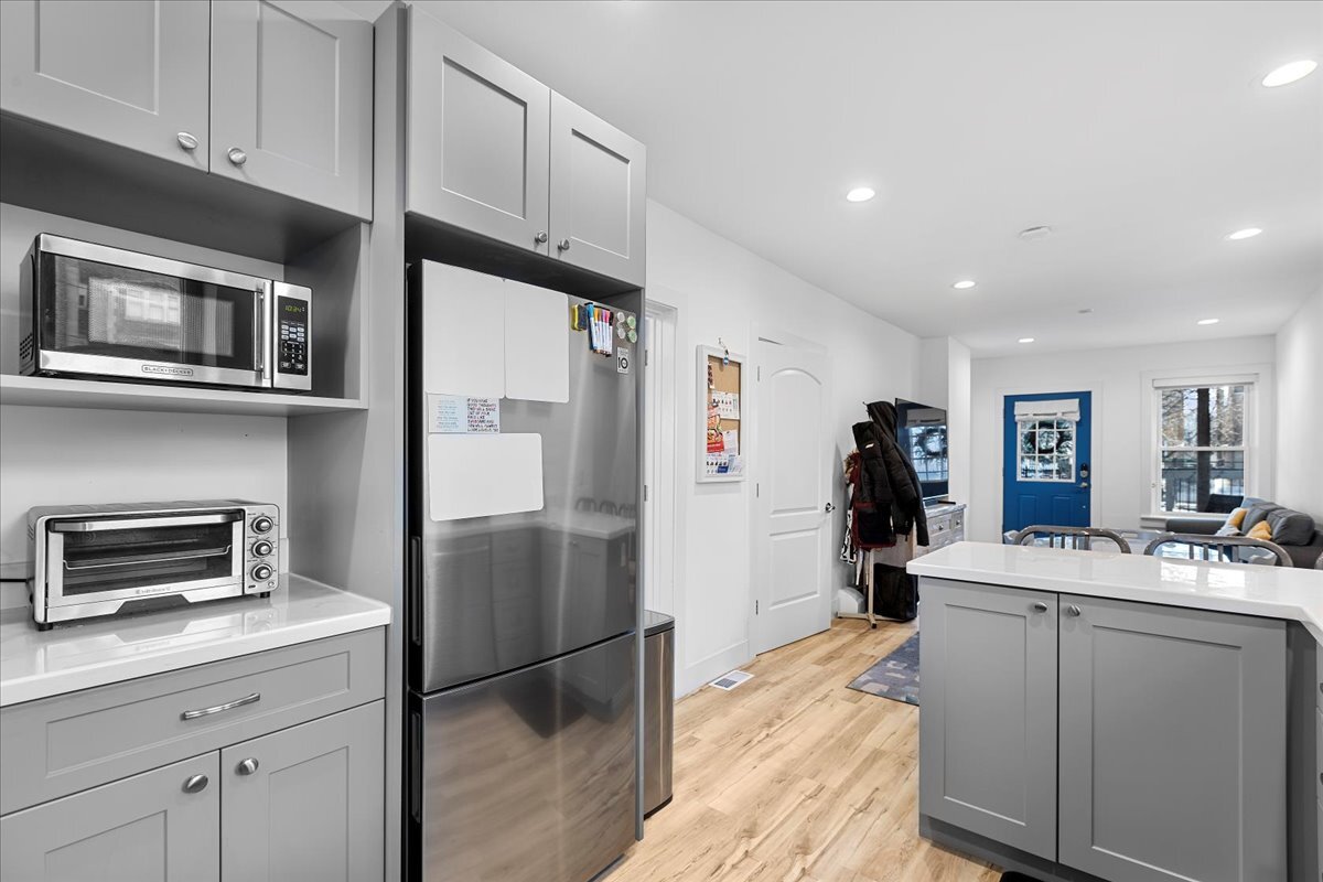 3144 North Spaulding Avenue, Unit 1 Chicago, IL 60618 - Photo 4 of 13 a kitchen with a refrigerator and a sink
