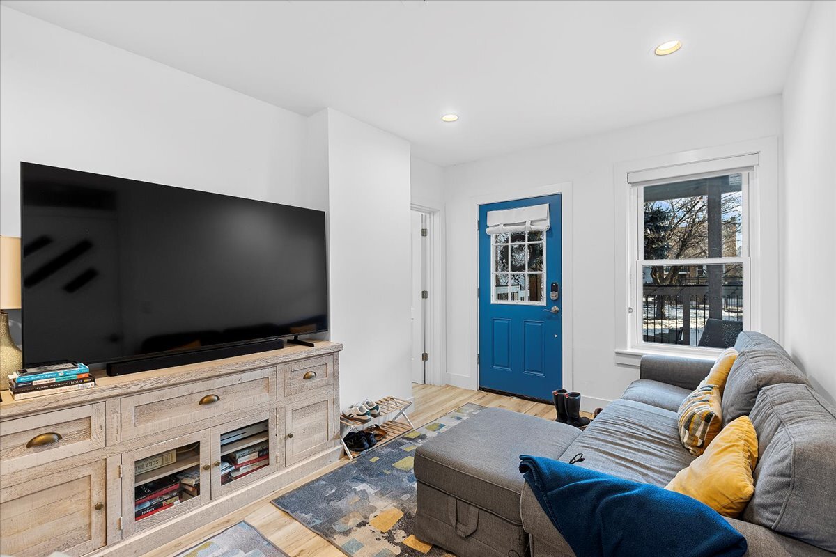 3144 North Spaulding Avenue, Unit 1 Chicago, IL 60618 - Photo 8 of 13 a living room with furniture and a flat screen tv