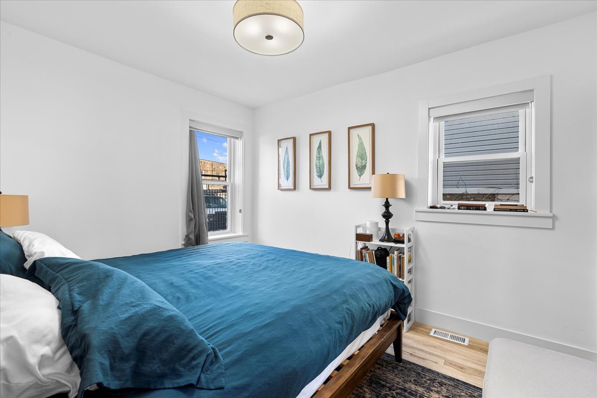 3144 North Spaulding Avenue, Unit 1 Chicago, IL 60618 - Photo 10 of 13 a bedroom with a bed and a window