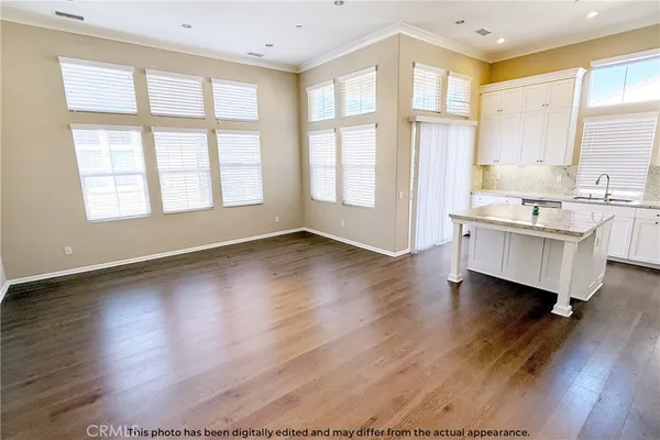 a kitchen with stainless steel appliances a refrigerator sink and microwave
