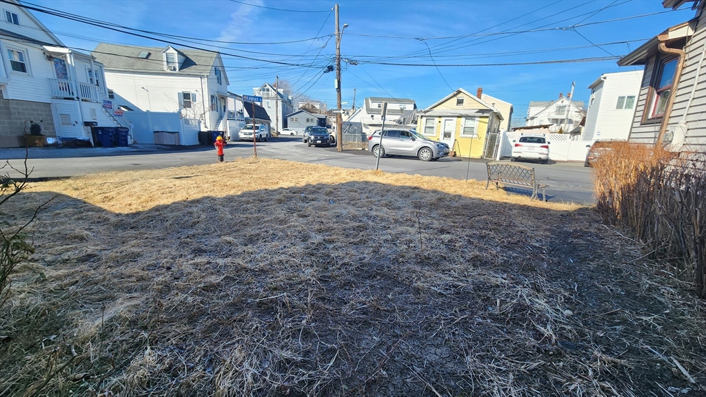 2 Leonard Road Revere, MA 02151 - Photo 1 of 8 a view of a backyard of the house