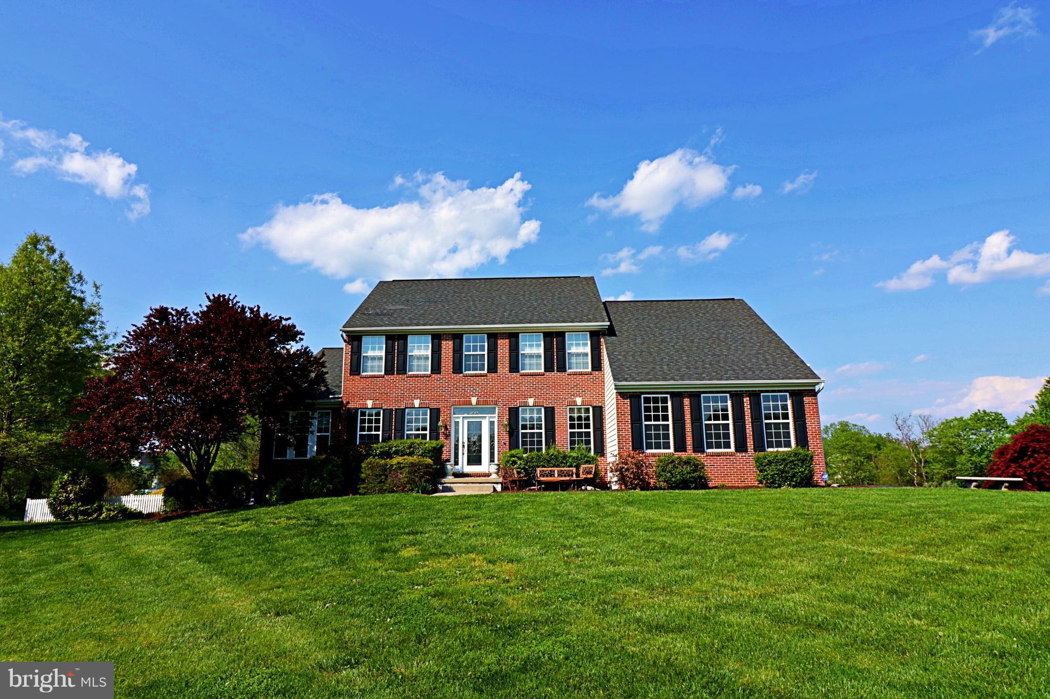517 Rudder Road Shepherdstown, WV 25443 - Photo 1 of 25 a front view of a house with a garden