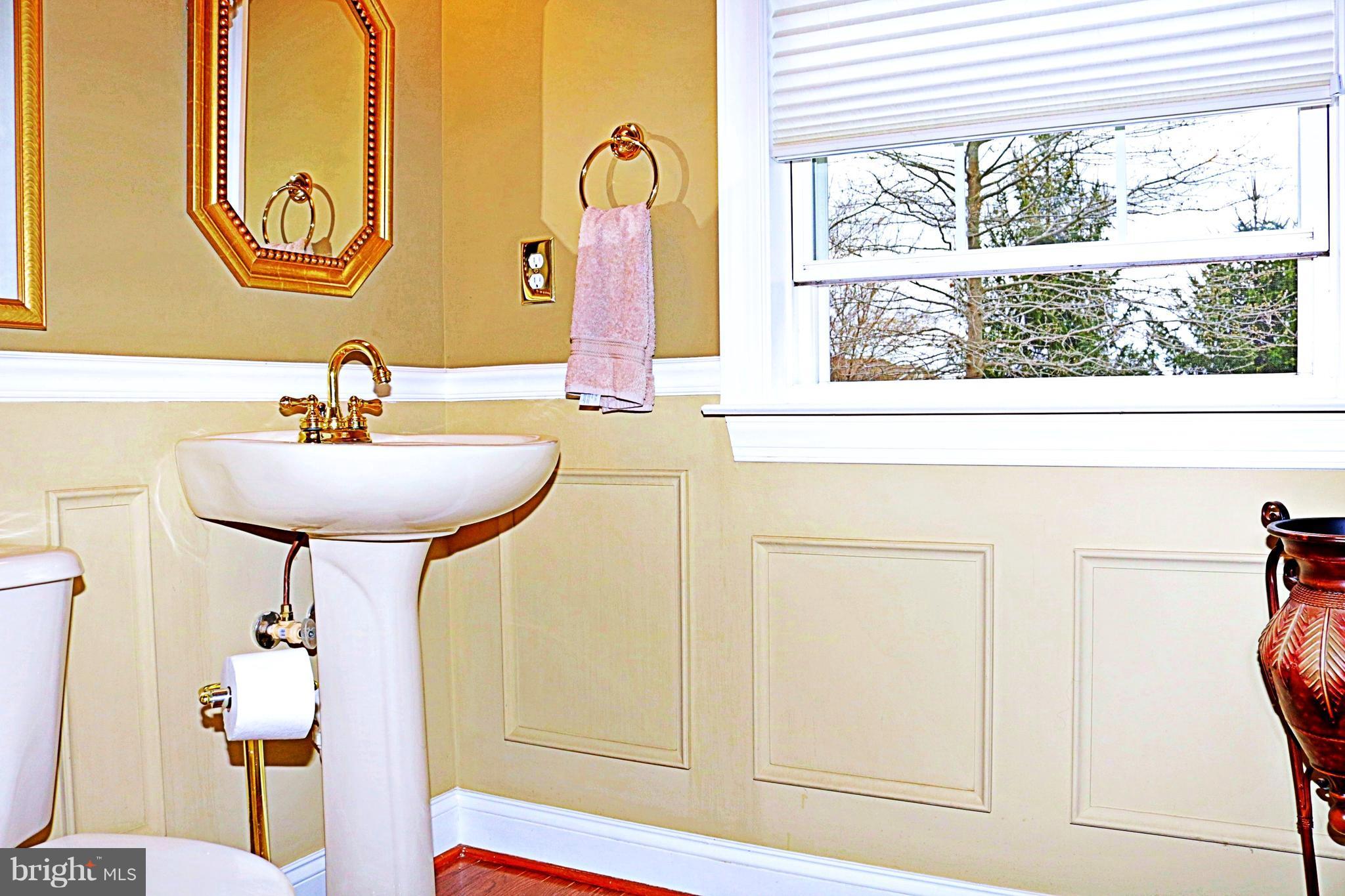 517 Rudder Road Shepherdstown, WV 25443 - Photo 14 of 25 a bathroom with a sink and a mirror