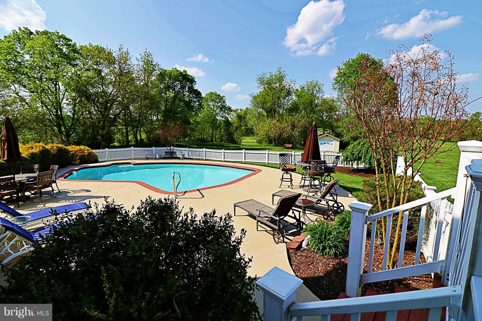 517 Rudder Road Shepherdstown, WV 25443 - Photo 23 of 25 a view of a swimming pool with a patio and a yard