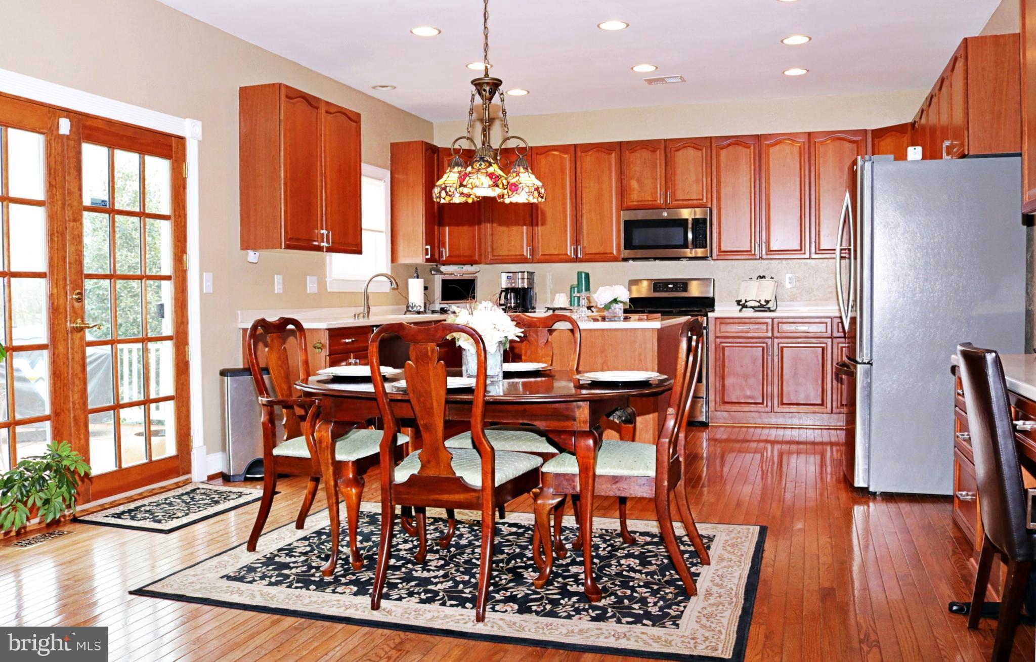 517 Rudder Road Shepherdstown, WV 25443 - Photo 10 of 25 a view of a dining room with furniture kitchen and wooden floor
