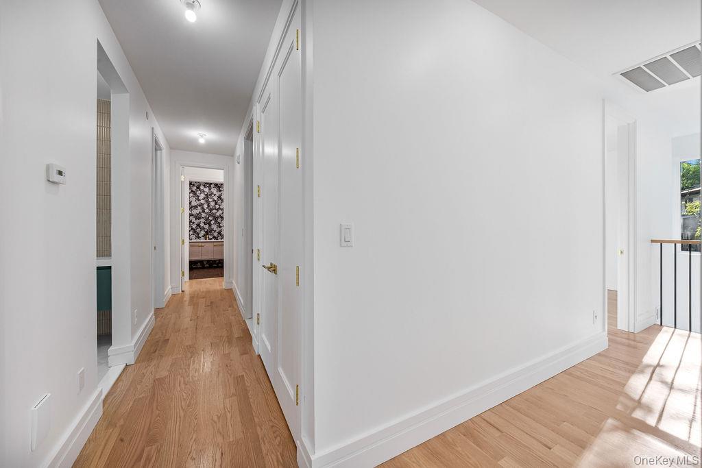 40 Singer Avenue, Unit 201 Spring Valley, NY 10977 - Photo 19 of 50 a view of a hallway with wooden floor