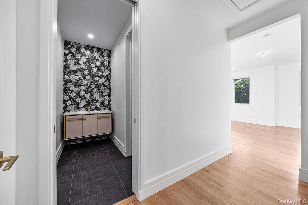 40 Singer Avenue, Unit 201 Spring Valley, NY 10977 - Photo 22 of 50 a view of a hallway with wooden floor and a window